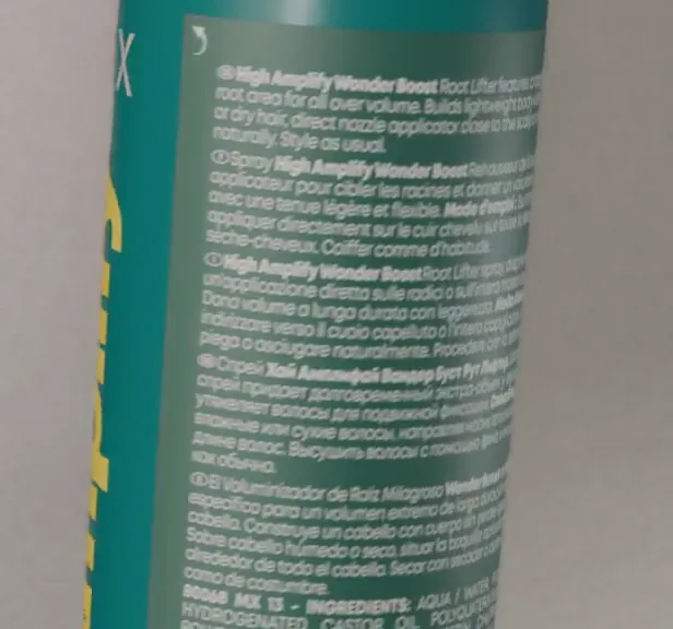 Rendered frame of the back of a bottle with legible multilingual directions and ingredient list