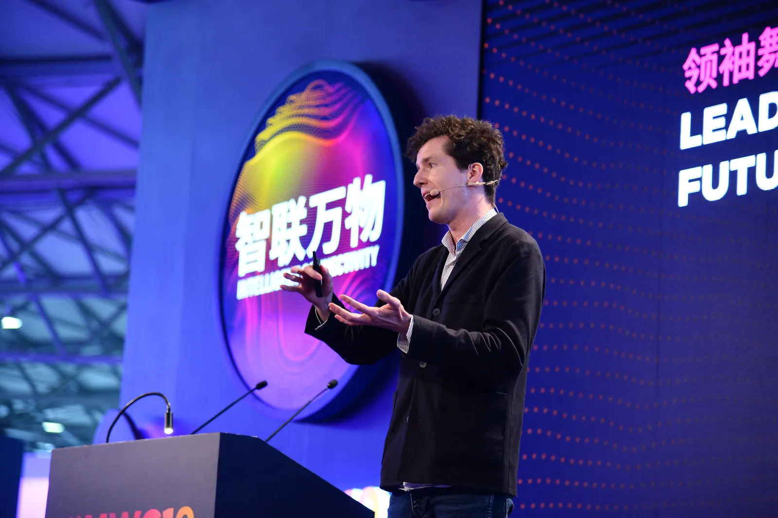 Ivan Puzyrev mid-talk with a headset microphone at MWC Shanghai